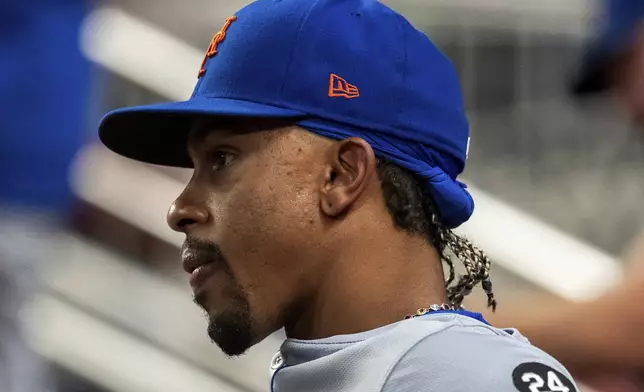 New York Mets shortstop Francisco Lindor sits in the dugout during the third inning of a baseball game against the Atlanta Braves, Tuesday, Sept. 24, 2024, in Atlanta. (AP Photo/Jason Allen)