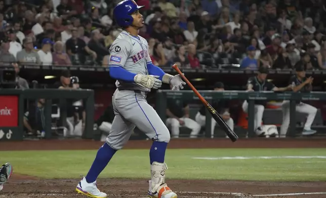 New York Mets' Francisco Lindor reacts after hitting a solo home run against the Arizona Diamondbacks in the sixth inning during a baseball game, Thursday, Aug 29, 2024, in Phoenix. (AP Photo/Rick Scuteri)