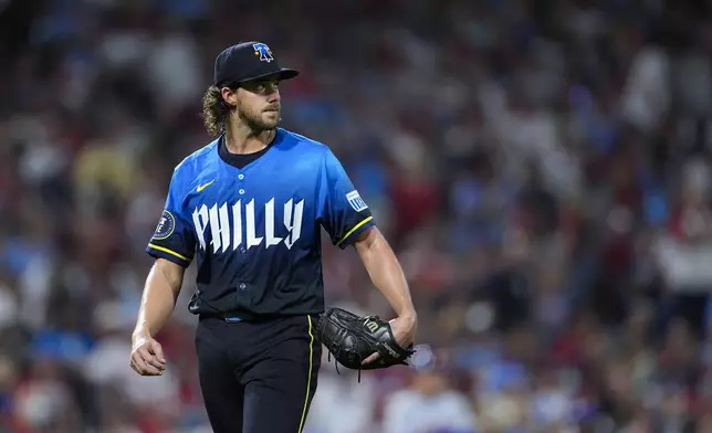 Philadelphia Phillies' Aaron Nola walks off the field after he was removed during the fifth inning of a baseball game against the New York Mets, Friday, Sept. 13, 2024, in Philadelphia. (AP Photo/Derik Hamilton)