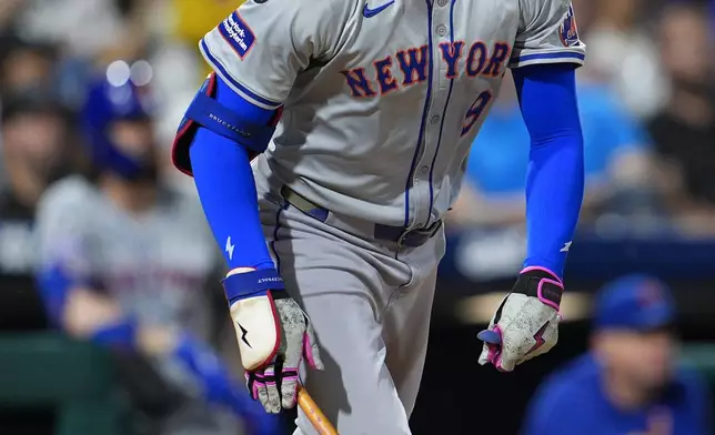 New York Mets' Brandon Nimmo watches his three run home run off Philadelphia Phillies' Aaron Nola during the fifth inning of a baseball game, Friday, Sept. 13, 2024, in Philadelphia. (AP Photo/Derik Hamilton)