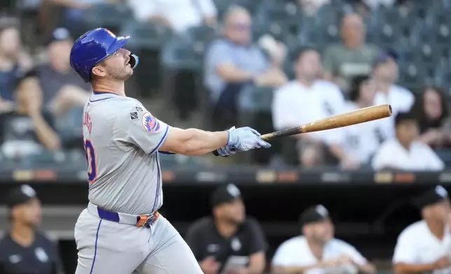 New York Mets' Pete Alonso watches his two-run home run off Chicago White Sox starting pitcher Davis Martin during the first inning of a baseball game Saturday, Aug. 31, 2024, in Chicago. (AP Photo/Charles Rex Arbogast)