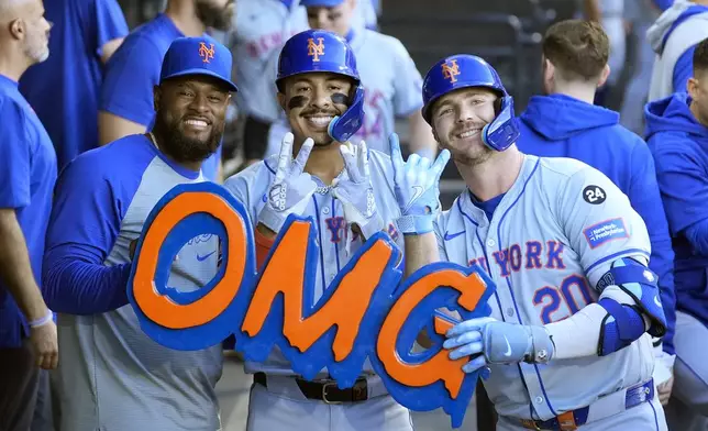 The New York Mets from left, Luis Severino, Mark Vientos, and Pete Alonso, celebrate Alonso's two-run home run off Chicago White Sox starting pitcher Davis Martin during the first inning of a baseball game Saturday, Aug. 31, 2024, in Chicago. (AP Photo/Charles Rex Arbogast)