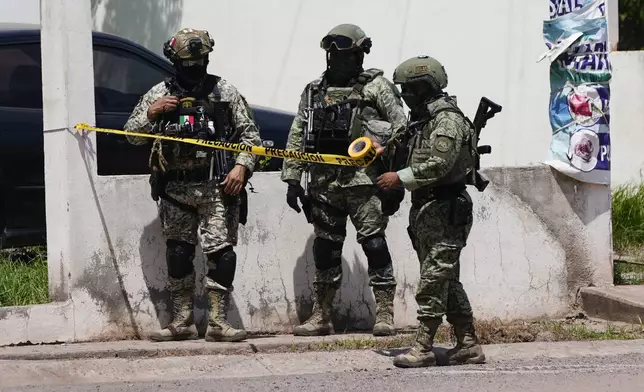 Soldiers cordon off a neighborhood during an operation in Culiacan, Sinaloa state, Mexico, Thursday, Sept. 19, 2024. (AP Photo/Eduardo Verdugo)