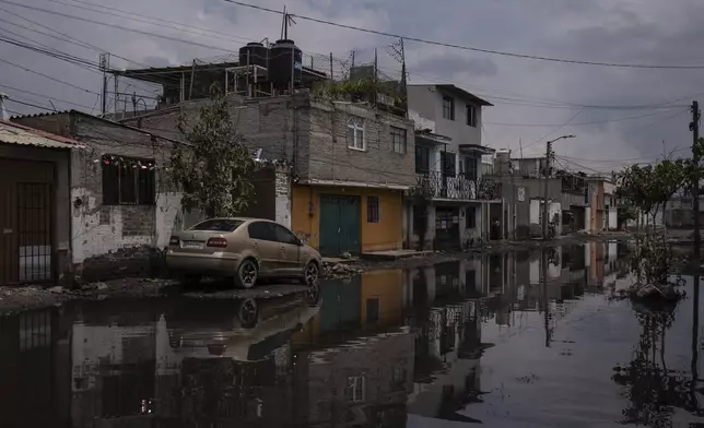 Sewage-infused floodwaters cover a street in Valle de Chalco, State of Mexico, Thursday, Aug. 29, 2024. (AP Photo/Felix Marquez)