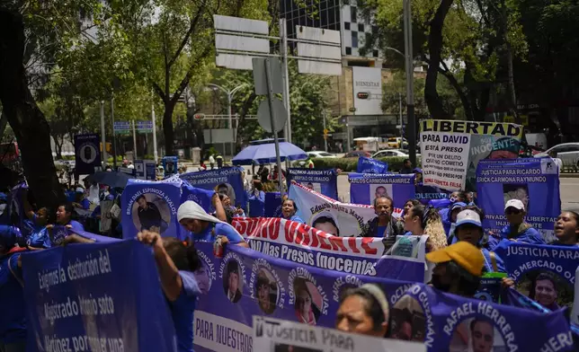 Relatives of prisoners rally in favor of the government's proposed judicial reform in Mexico City, Wednesday, Sept. 4, 2024. (AP Photo/Felix Marquez)