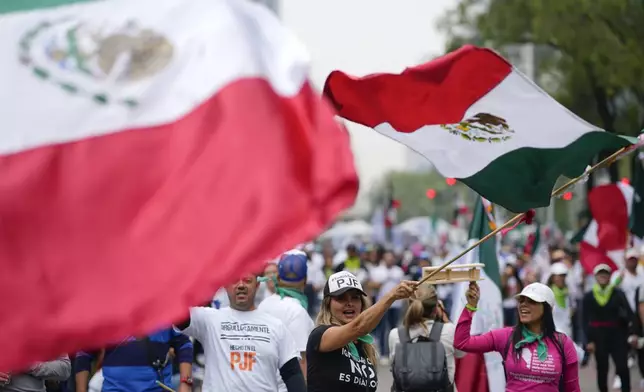 Judicial workers protest the government's proposed judicial reform, which would make judges stand for election, outside the Senate in Mexico City, Tuesday, Sept. 10, 2024. (AP Photo/Eduardo Verdugo)