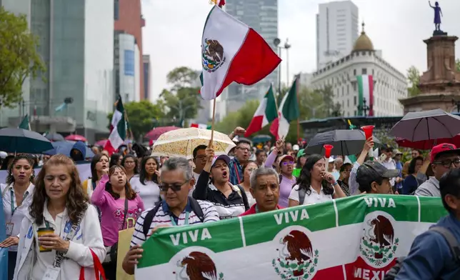 Judicial workers protest the government's proposed judicial reform, which would make judges stand for election, outside the Senate in Mexico City, Tuesday, Sept. 10, 2024. (AP Photo/Eduardo Verdugo)