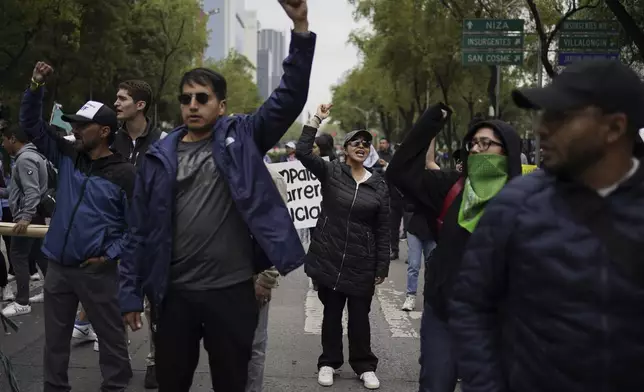 Demonstrators protest outside the Senate against the judicial reform bill in Mexico City, Thursday, Sept. 5, 2024, the day after Congress passed legislation that would require all judges to stand for election. (AP Photo/Felix Marquez)