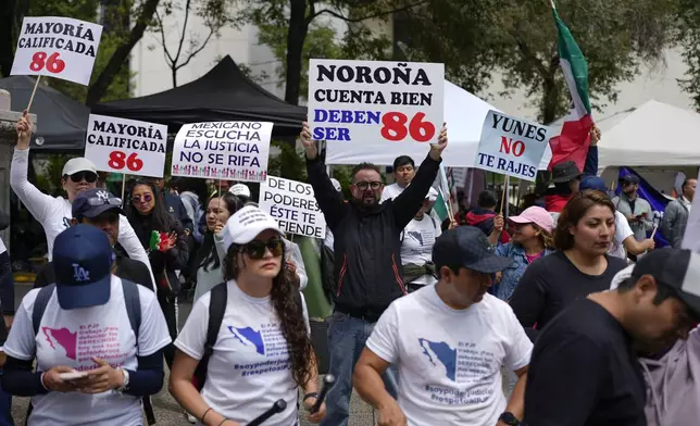 Judicial workers protest the government's proposed judicial reform, which would make judges stand for election, outside the Senate in Mexico City, Tuesday, Sept. 10, 2024. (AP Photo/Eduardo Verdugo)