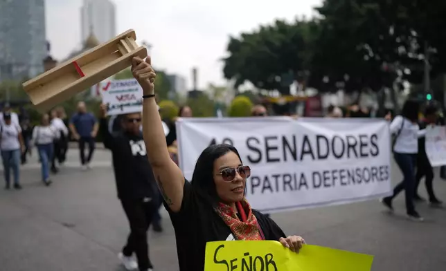 Judicial workers protest the government's proposed judicial reform, which would make judges stand for election, outside the Senate in Mexico City, Tuesday, Sept. 10, 2024. (AP Photo/Eduardo Verdugo)