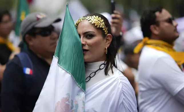 A judicial worker protests the government's proposed judicial reform, which would make judges stand for election, outside the Senate in Mexico City, Tuesday, Sept. 10, 2024. (AP Photo/Eduardo Verdugo)