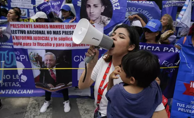 Relatives of prisoners rally in favor of the government's proposed judicial reform in Mexico City, Wednesday, Sept. 4, 2024. (AP Photo/Felix Marquez)