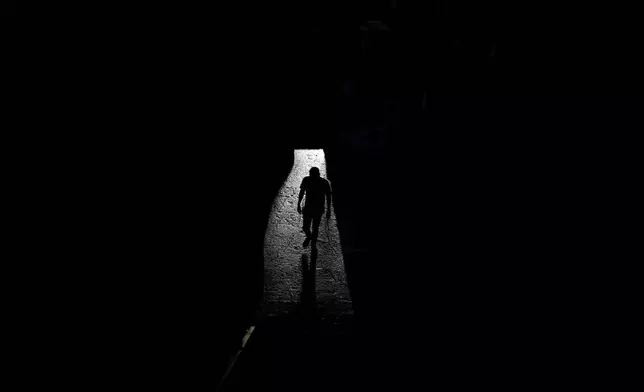 A visitor walks through the interior of the Anahuacalli Museum in Mexico City, Tuesday, Aug. 20, 2024. Built by Mexican artist Diego Rivera to preserve and display his lifelong collection of pre-Hispanic art, the museum is celebrating its 60th anniversary. (AP Photo/Eduardo Verdugo)