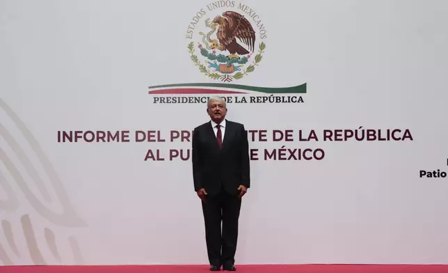 FILE - Mexican President Andres Manuel Lopez Obrador stands before giving an address to the nation at the National Palace in Mexico City, April 5, 2020. (AP Photo/Eduardo Verdugo, File)