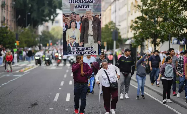 FILE - People arrive to the Zocalo for outgoing Mexican President Andres Manuel Lopez Obrador's last State of the Nation address in Mexico City, Sept. 1, 2024. (AP Photo/Eduardo Verdugo, File)