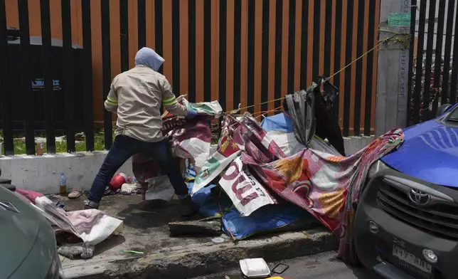 City workers dismantled an abandoned makeshift camp that was known as "Little Haiti" in the Tláhuac borough of Mexico City, Friday, July 5, 2024. (AP Photo/Marco Ugarte)