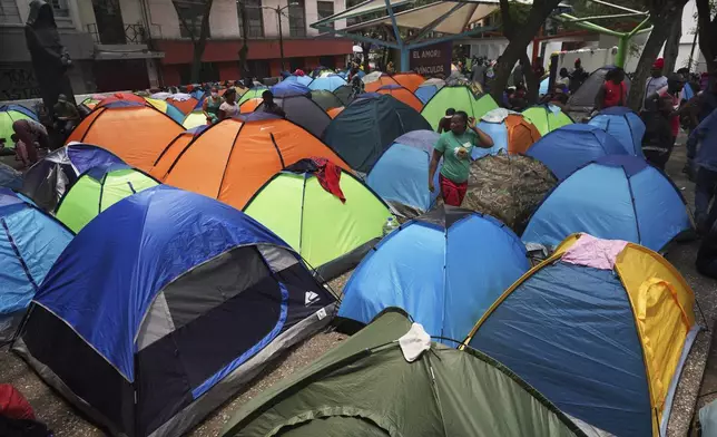 FILE - Haitian migrants camp out at the Giordano Bruno plaza in the Juarez neighborhood of Mexico City, May 18, 2023. Federal immigration authorities cleared the tent encampment two weeks later, one of the largest in the city's downtown. (AP Photo/Marco Ugarte, File)