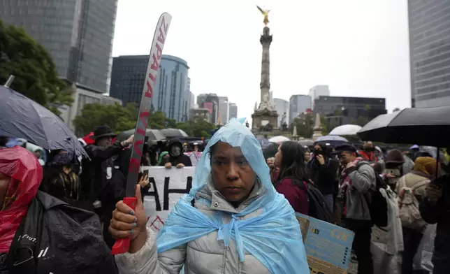 Families and friends take part in a demonstration marking the 10-year anniversary of the disappearance of 43 students from an Ayotzinapa rural teacher's college, in Mexico City, Thursday, Sept. 26, 2024. (AP Photo/Fernando Llano)