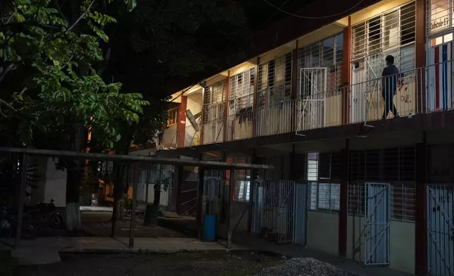 A student walks at the dormitory of the Raúl Isidro Burgos Rural Normal School in Ayotzinapa, Guerrero state, Mexico, Sunday, Aug. 25, 2024. (AP Photo/Felix Marquez)