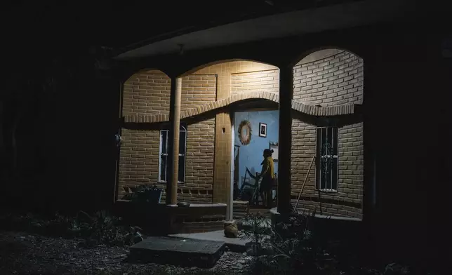 Mayrani Ascencio, whose brother Benjamin is one of 43 missing students from the Raúl Isidro Burgos Rural Normal School stands at home in Tixtla, Guerrero state, Mexico, late Friday, Aug. 23, 2024. (AP Photo/Felix Marquez)