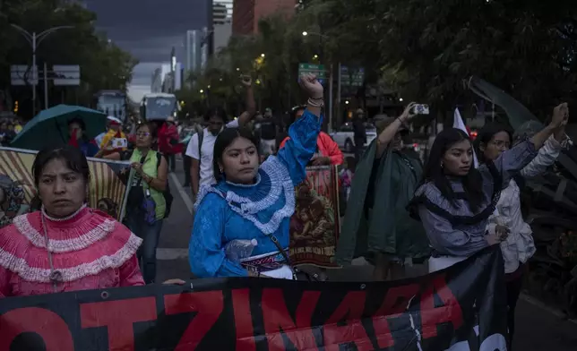 Indigenous women protest for justice in the 10-year case of 43 missing students from the Raúl Isidro Burgos Rural Normal School in Mexico City, Monday, Aug. 26, 2024. (AP Photo/Felix Marquez)