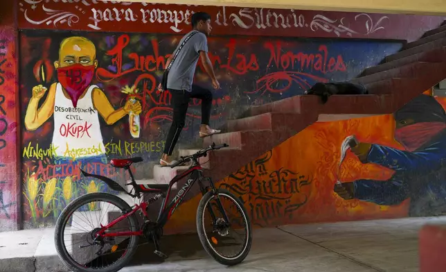 Murals and the number 43 decorate the dormitory area at the Raúl Isidro Burgos Rural Normal School, the teachers' college from where 43 students went missing 10 years ago, in Ayotzinapa, Guerrero state, Mexico, Monday, Aug. 19, 2024. (AP Photo/Marco Ugarte)