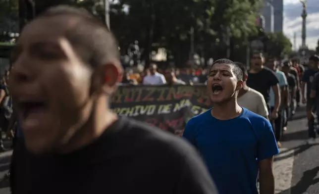 Jesus Castro Rafaela, a first-year student at the Raúl Isidro Burgos Rural Normal School protests for justice in the 10-year case of 43 missing classmates, in Mexico City, Monday, Aug. 26, 2024. (AP Photo/Felix Marquez)