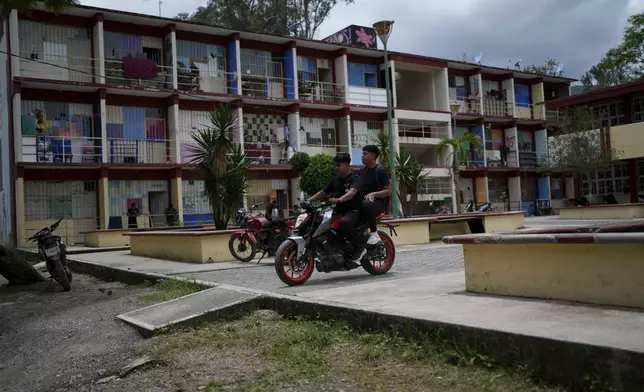 Students leave the dormitory area of the Raúl Isidro Burgos Rural Normal School in Ayotzinapa, Guerrero state, Mexico, Monday, Aug. 19, 2024. (AP Photo/Marco Ugarte)