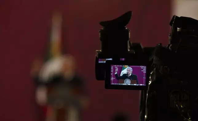 FILE - Mexican President Andres Manuel Lopez Obrador is seen on a camera screen as he gives his daily, morning news conference at the presidential palace in Mexico City, Dec. 18, 2020. (AP Photo/Marco Ugarte, File)