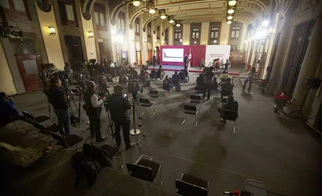 FILE - Mexican President Andres Manuel Lopez Obrador gives his regular morning press conference at the Palacio Nacional in Mexico City, Dec. 18, 2020. (AP Photo/Marco Ugarte, File)