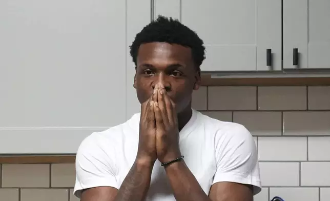 Armorion Smith, an NCAA football player at Michigan State, takes a moment by himself at home in Lansing, Mich., Tuesday, Sept. 3, 2024. (AP Photo/Paul Sancya)