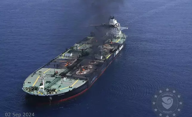 This photo released by the European Union's Operation Aspides naval force shows the Greek-flagged oil tanker Sounion burning in the Red Sea following a series of attacks by Yemen's Houthi rebels on Monday, Sept. 2, 2024. (European Union's Operation Aspides via AP)