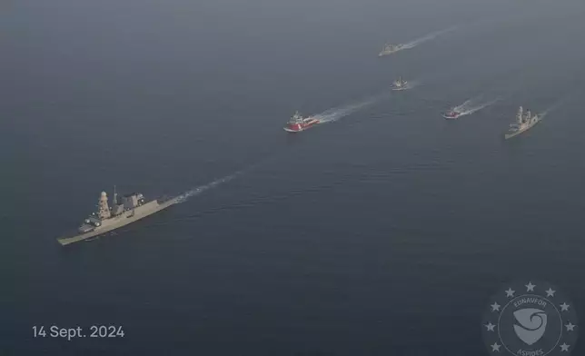 This photo released by the European Union’s Operation Aspides shows warships attached to the mission escorting salvage ships in the Red Sea on Saturday, Sept. 14, 2024. A new attempt has begun to try to salvage an oil tanker burning in the Red Sea after attacks by Yemen’s Houthi rebels, a European Union naval mission said Saturday. (European Union's Operation Aspides via AP)