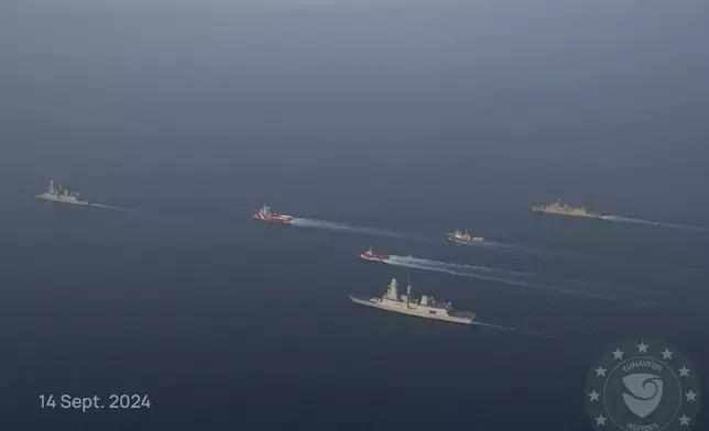 This photo released by the European Union’s Operation Aspides shows warships attached to the mission escorting salvage ships in the Red Sea on Saturday, Sept. 14, 2024. A new attempt has begun to try to salvage an oil tanker burning in the Red Sea after attacks by Yemen’s Houthi rebels, a European Union naval mission said Saturday. (European Union's Operation Aspides via AP)