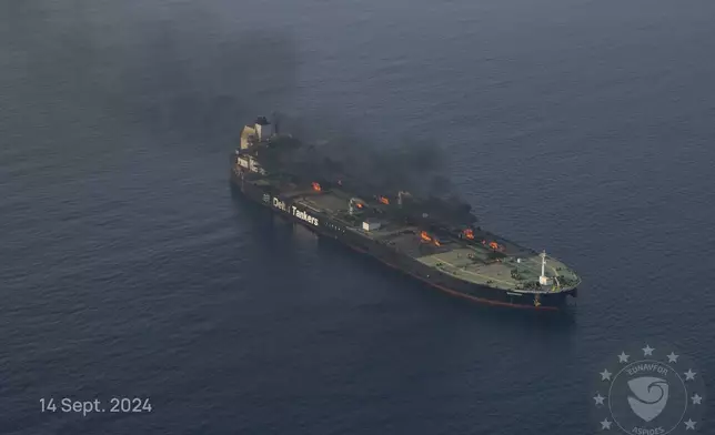 This photo released by the European Union's Operation Aspides naval force shows the oil tanker Sounion burning in the Red Sea following a series of attacks by Yemen's Houthi rebels, on Saturday Sept. 14, 2024. (European Union's Operation Aspides via AP)