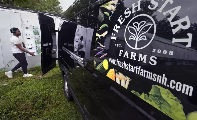 Vegetables picked and packaged that morning are loaded onto a delivery truck at Fresh Start Farm, Aug. 19, 2024, in Dunbarton, N.H. (AP Photo/Charles Krupa)