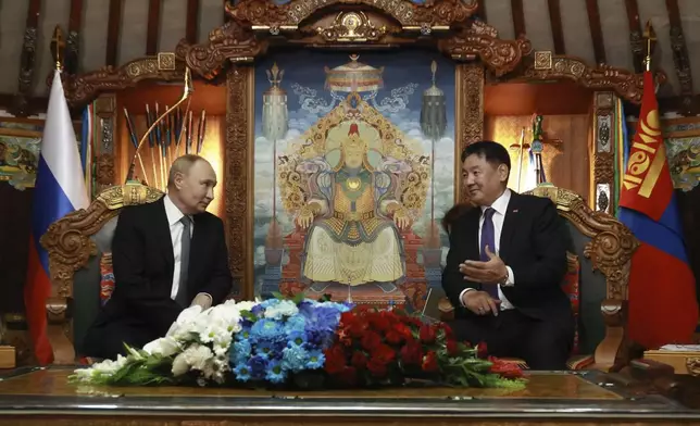 Russian President Vladimir Putin, left, and Mongolian President Ukhnaagiin Khurelsukh attend a meeting at the Saaral Ordon Government Building in Ulaanbaatar, Mongolia, Tuesday, Sept. 3, 2024. (Vyacheslav Prokofyev, Sputnik, Kremlin Pool Photo via AP)