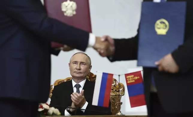 Russian President Vladimir Putin attends a signing ceremony following the Russian-Mongolian talks at the Government Palace in Ulaanbaatar, Mongolia, Tuesday, Sept. 3, 2024. (Sofia Sandurskaya, Sputnik, Kremlin Pool Photo via AP)