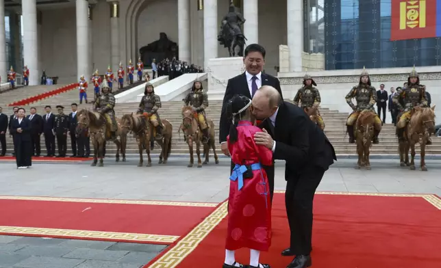 Russian President Vladimir Putin, right, and Mongolian President Ukhnaagiin Khurelsukh attend a welcoming ceremony at Sukhbaatar Square in Ulaanbaatar, Mongolia, Tuesday, Sept. 3, 2024. (Vyacheslav Prokofyev, Sputnik, Kremlin Pool Photo via AP)