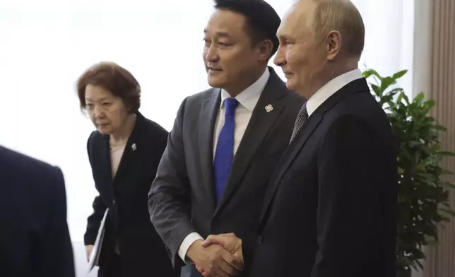 Russian President Vladimir Putin, right, and Chairman of the State Great Hural (Parliament) of Mongolia Dashzegve Amarbayasgalan attend a meeting at the Government Palace in Ulaanbaatar, Mongolia, Tuesday, Sept. 3, 2024. (Vyacheslav Prokofyev, Sputnik, Kremlin Pool Photo via AP)