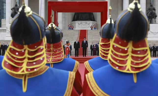 Russian President Vladimir Putin, centre left, and Mongolian President Ukhnaagiin Khurelsukh attend a welcome ceremony in Sukhbaatar Square in Ulaanbaatar, Mongolia, Tuesday, Sept. 3, 2024. (Vyacheslav Prokofyev, Sputnik, Kremlin Pool Photo via AP)