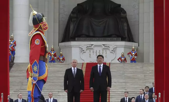 Russian President Vladimir Putin, center left, and Mongolian President Ukhnaagiin Khurelsukh, center right, attend a welcome ceremony in Sukhbaatar Square in Ulaanbaatar, Mongolia, Tuesday, Sept. 3, 2024. (Vyacheslav Prokofyev, Sputnik, Kremlin Pool Photo via AP)