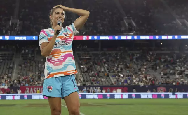 San Diego Wave's Alex Morgan speaks after an NWSL soccer game against the North Carolina Courage on Sunday, Sept. 8 2024, in San Diego. (Sandy Huffaker/The San Diego Union-Tribune via AP)