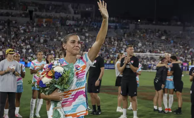 San Diego Wave's Alex Morgan waves after an NWSL soccer game against the North Carolina Courage on Sunday, Sept. 8 2024, in San Diego. (Sandy Huffaker/The San Diego Union-Tribune via AP)