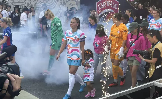 San Diego Wave's Alex Morgan takes to the field before an NWSL soccer game against the North Carolina Courage on Sunday, Sept. 8, 2024, at Snapdragon Stadium in San Diego. (AP Photo/Eddie Elston)