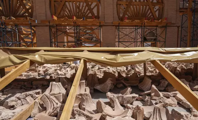 Recovered pieces of the Great Mosque of Tinmel, which suffered significant damage during a 2023 earthquake, are collected in the Atlas mountain village of Tinmel, outside of Marrakech, Morocco, Thursday, Sept. 5, 2024. (AP Photo/Mosa'ab Elshamy)