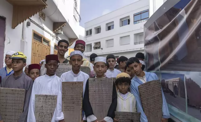 Boys from traditional Quranic schools pose for photo as they take part in a parade celebrating the birth anniversary of Prophet Muhammad near Rabat, Morocco, Sunday, Sept. 15, 2024. (AP Photo/Mosa'ab Elshamy)