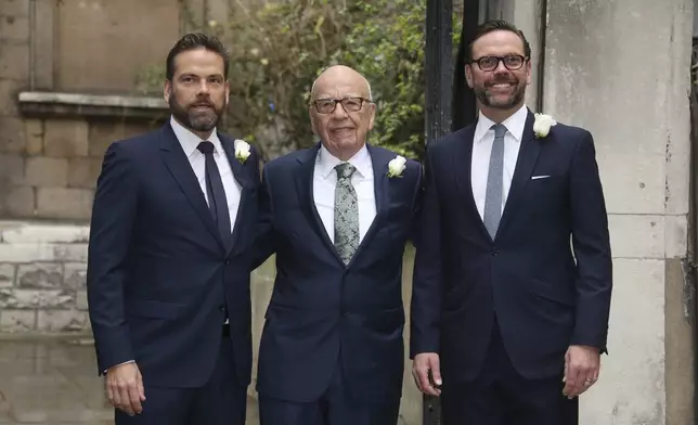 FILE - From left, Lachlan Murdoch, Rupert Murdoch and James Murdoch arrive at St Bride's Church for the celebration ceremony of the wedding of Rupert Murdoch and Jerry Hall in London, Saturday, March 5, 2016. (Photo by Joel Ryan/Invision/AP, File)