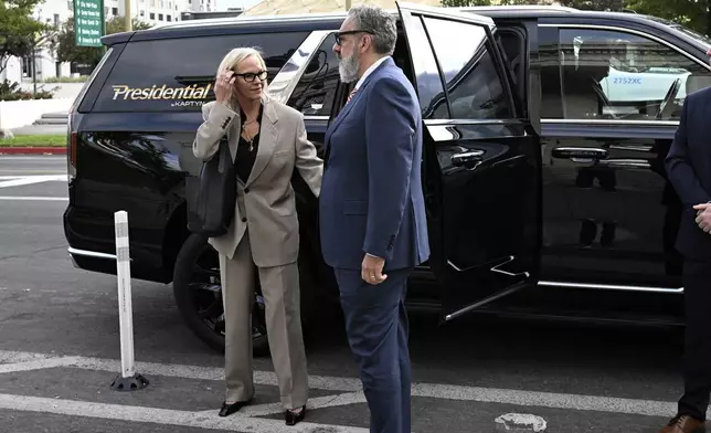 Elisabeth Murdoch, left, arrives at the Second Judicial District Court in Reno, Nev., Monday Sept. 16, 2024. (AP Photo/Andy Barron)