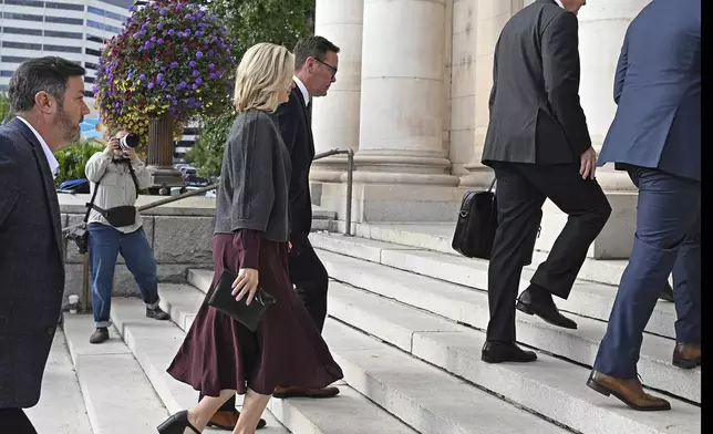 James Murdoch, center, arrives at the Second Judicial District Court in Reno, Nev. on Monday Sept. 16, 2024. (AP Photo/Andy Barron)